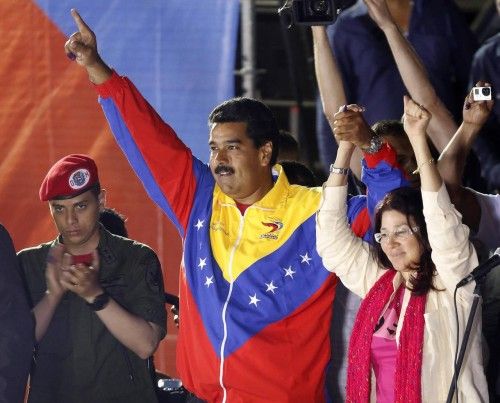 Venezuelan presidential candidate Maduro and wife celebrate after the official results gave him a victory in Caracas