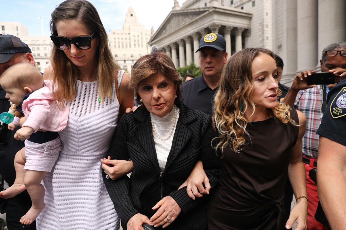 NEW YORK, NEW YORK - AUGUST 27: Attorney Gloria Allred (center) leaves a New York court house with two women, a woman who did not wish to be identified (left) and Teala Davies( right), who have publicly accused Jeffrey Epstein of sexually assaulting them on August 27, 2019 in New York City. Their appearance followed a hearing in which U.S. District Judge Richard Berman is to decide whether to officially dismiss charges against the dead financier after the 66-year-old killed himself in a New York jail cell while awaiting his sex trafficking trial. In testimony in front of the judge, over a than a dozen women spoke about how they were sexually abused and trafficked by Epstein at his numerous homes across the country.   Spencer Platt/Getty Images/AFP