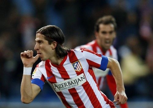 Atletico Madrid's Filipe Luis celebrates his goal against Real Betis during their King's Cup quarter-final first leg match at Vicente Calderon stadium in Madrid