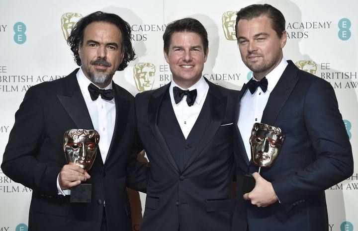 Best director Alejandro Inarritu and best leading actor Leonardo DiCaprio hold their awards as they stand with presenter Tom Cruise at the British Academy of Film and Television Arts (BAFTA) Awards at the Royal Opera House in London