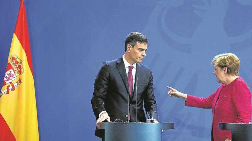 Merkel y Sánchez piden frenar la migración en origen