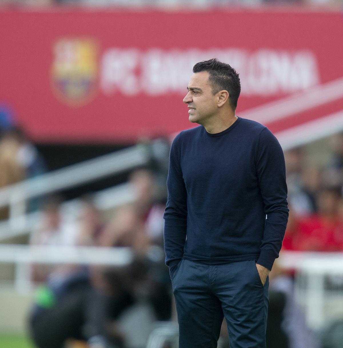 Xavi Hernández en la banda de Montjuic