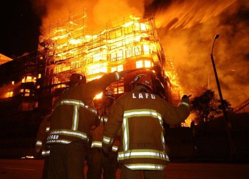 Los Angeles city firefighters battle a massive fire at a seven-story downtown apartment complex under construction in Los Angeles
