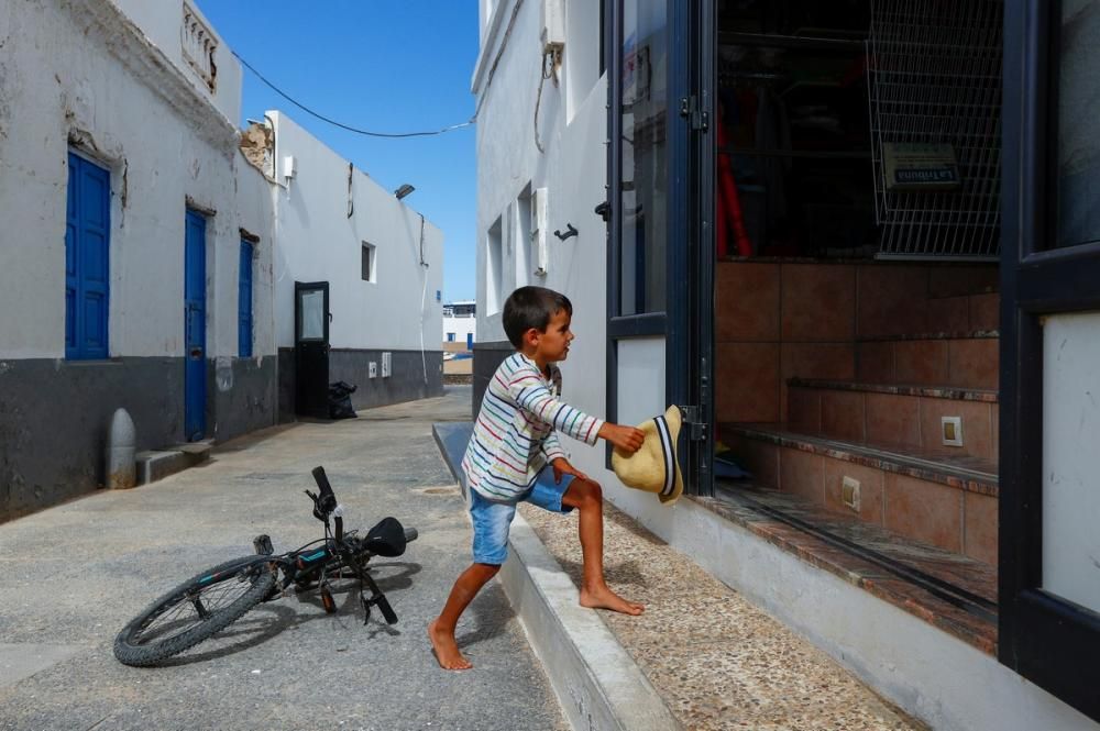 A child enters a store, as the country relaxes ...