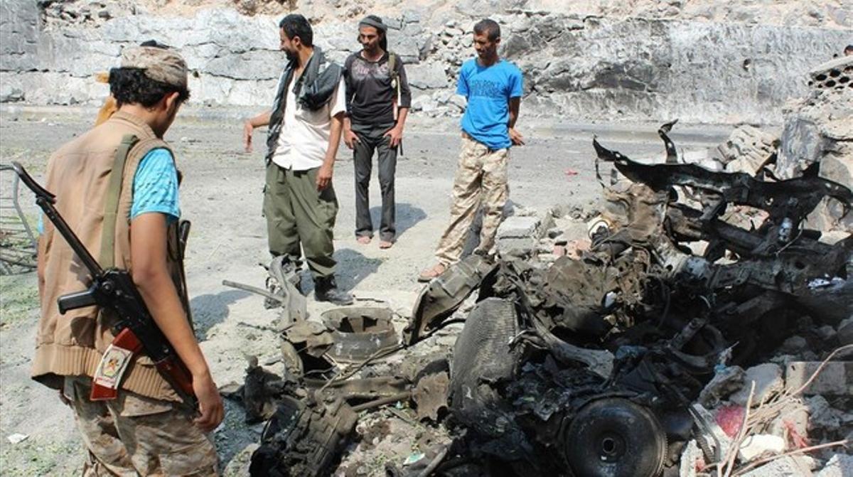 jjubierre32455205 armed yemeni men look at the wreckage of a vehicle160118164706