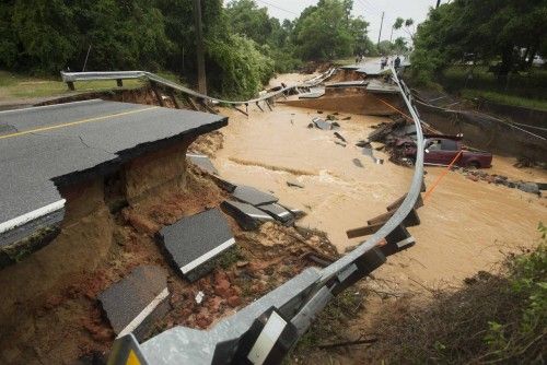 Damage due to flash flooding is seen along Johnson Ave. in Pensacola