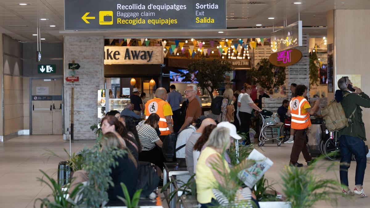 Tourists at Ibiza airport last summer.