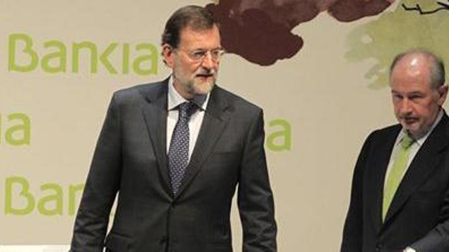 Rajoy, junto a Rato.