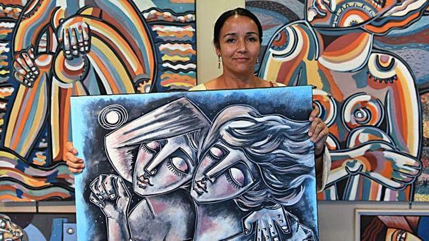 Vanesa Lodeiro con uno de sus cuadros en la Feria de Artes Plásticas.