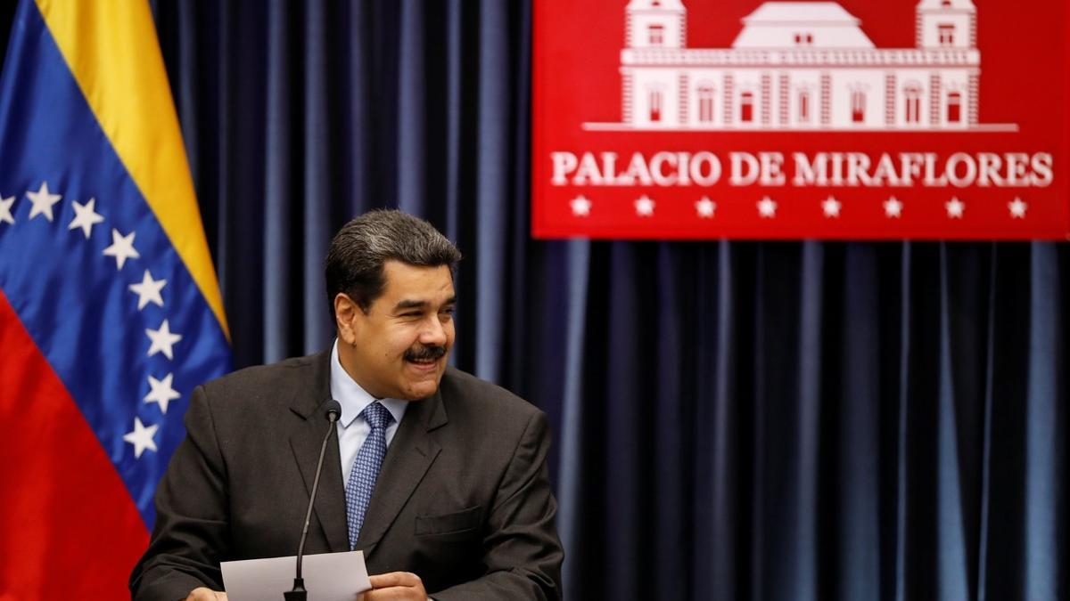 Venezuela's President Nicolas Maduro smiles as he talks to the media during a news conference at Miraflores Palace in Caracas