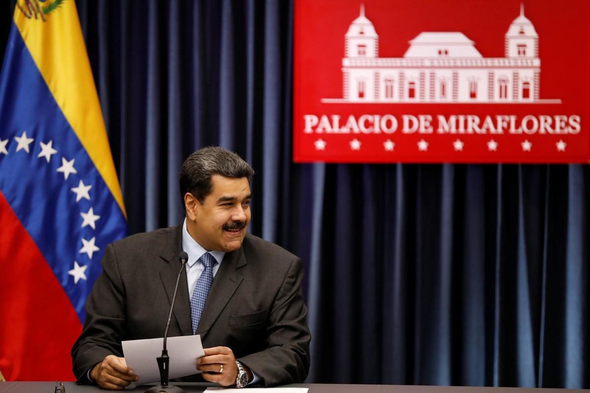 Venezuela s President Nicolas Maduro smiles as he talks to the media during a news conference at Miraflores Palace in Caracas  Venezuela  September 18  2018  REUTERS Marco Bello