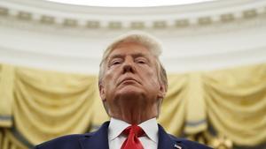 FILE - In this Oct. 24, 2019 file photo, President Donald Trump stands during a Presidential Medal of Freedom ceremony for auto racing great Roger Penske in the Oval Office of the White House in Washington. (AP Photo/Alex Brandon)