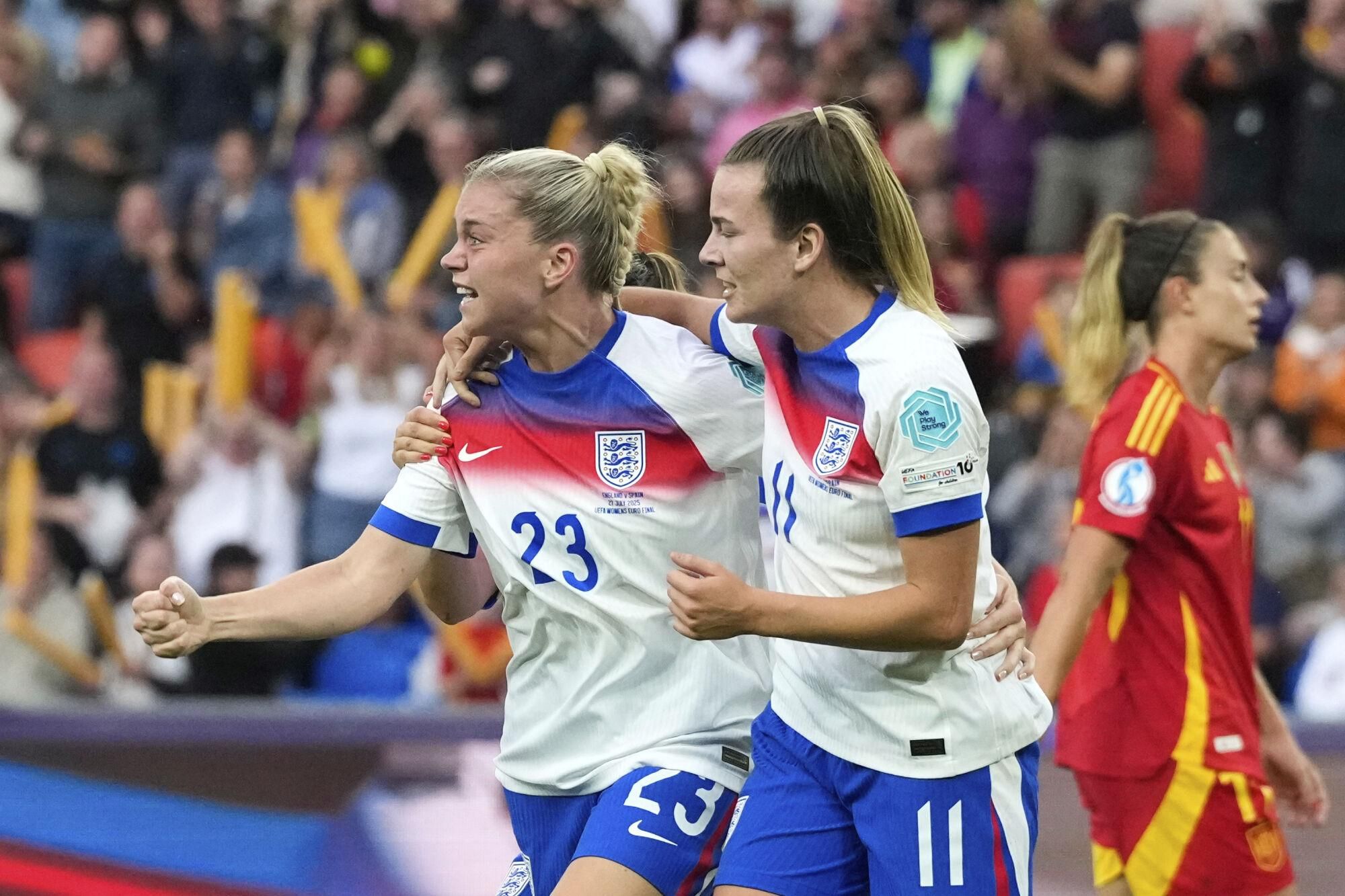 England's Alessia Russo, left, reacts after scoring her side's first goal during the Women's Euro 2025 final soccer match between England and Spain at St. Jakob-Park in Basel, Switzerland, Sunday, July 27, 2025. (AP Photo/Alessandra Tarantino)
