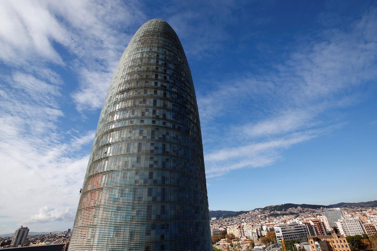 French climber Alain Robert, also known as The French Spiderman, scales the 38-story skyscraper Torre Agbar in Barcelona