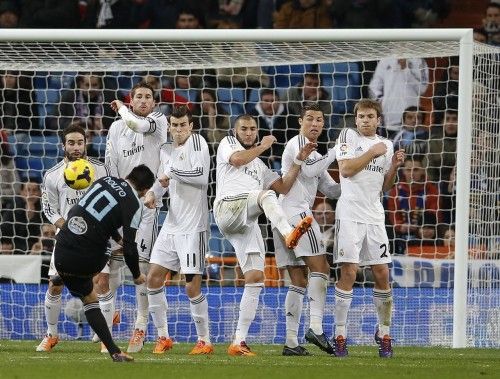 Celta Vigo's Nolito tries to score past Real Madrid players Carbajal, Ramos, Bale, Benzema, Ronaldo and Illarramendi during their Spanish First Division soccer match at Santiago Bernabeu stadium in Madrid