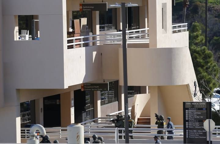 Law enforcement personnel converge on a buidling at the Naval Medical Center in San Diego