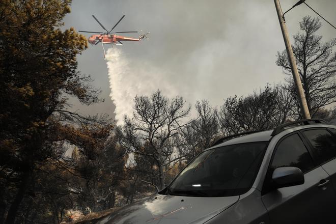 Wildfire spreads in Greeces Attica region