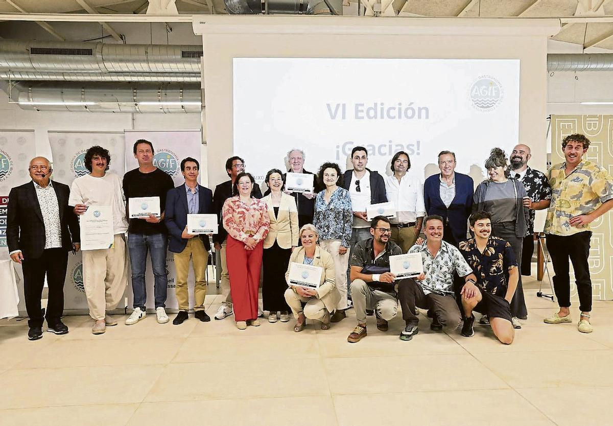 The winners pose with the diplomas recognising their awards.