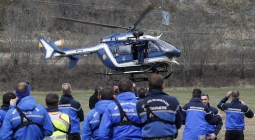 French Police and Gendarmerie Alpine rescue units gather on a field as they prepare to reach the crash site of an Airbus A320