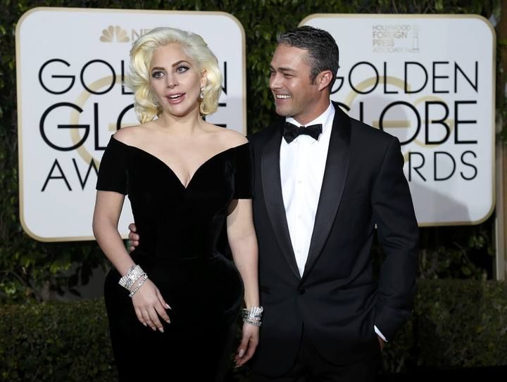 Singer Lady Gaga arrives with finance Taylor Kinney at the 73rd Golden Globe Awards in Beverly Hills