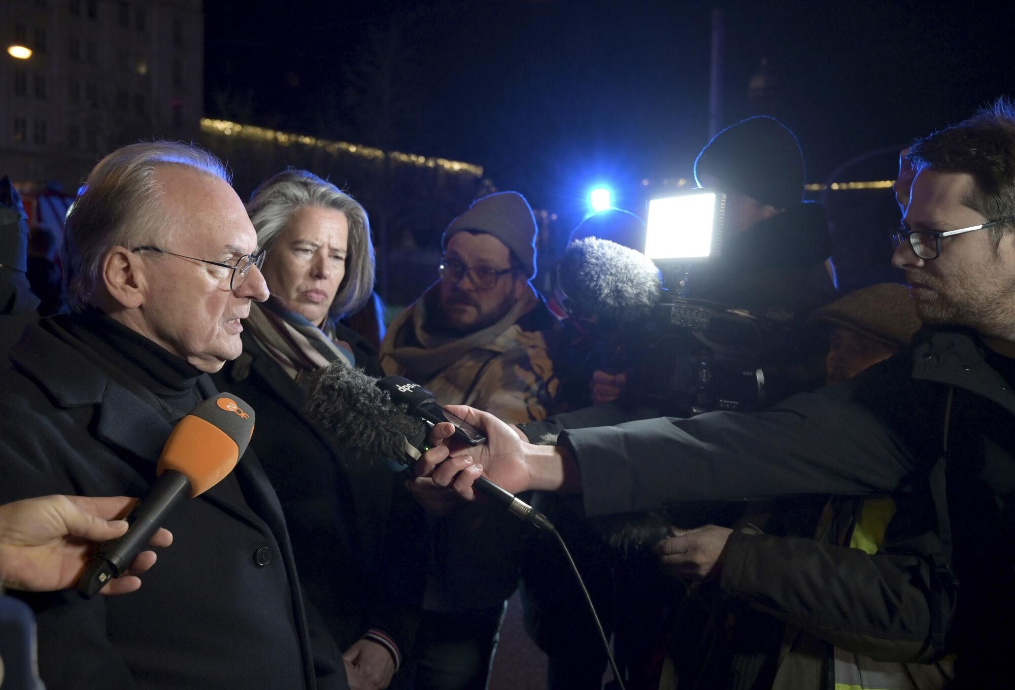 Reiner Haseloff (M, CDU), Minister President of Saxony-Anhalt, makes a statement after an incident at the Christmas market in Magdeburg, Germany, Friday Dec. 20, 2024. (Heiko Rebsch/dpa via AP). GERMANY OUT; MANDATORY CREDIT