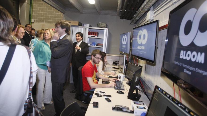 Joana Ortega, Carles Puigdemont i Richard Hebert, el juny de 2012, en la inauguració del Bloom.