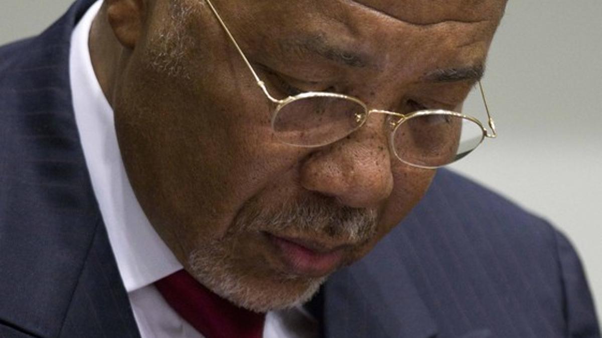 Former Liberian President Taylor looks down as he waits for the start of a hearing to receive a verdict in a court room of the Special Court for Sierra Leone in Leidschendam
