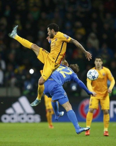 Barcelona's Alves fights for ball with BATE Borisov's Volodko during their Champions League group E soccer match at Borisov Arena stadium outside Minsk