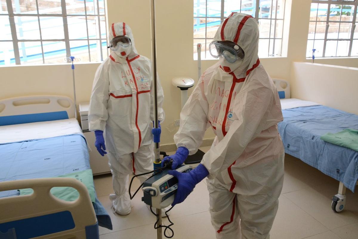 06 March 2020, Kenya, Nairobi: Staff of the coronavirus isolation ward of the hospital of Mbagathi are dressed in protective suits as they disinfects the hospital rooms. Photo: Dennis Sigwe/SOPA Images via ZUMA Wire/dpa