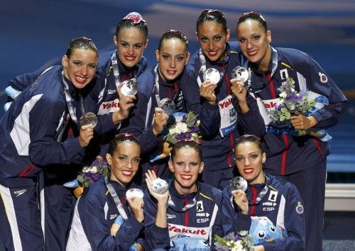 Second placed team of Spain show their bronze medals after the synchronised swimming team free final during the World Swimming Championships in Barcelona