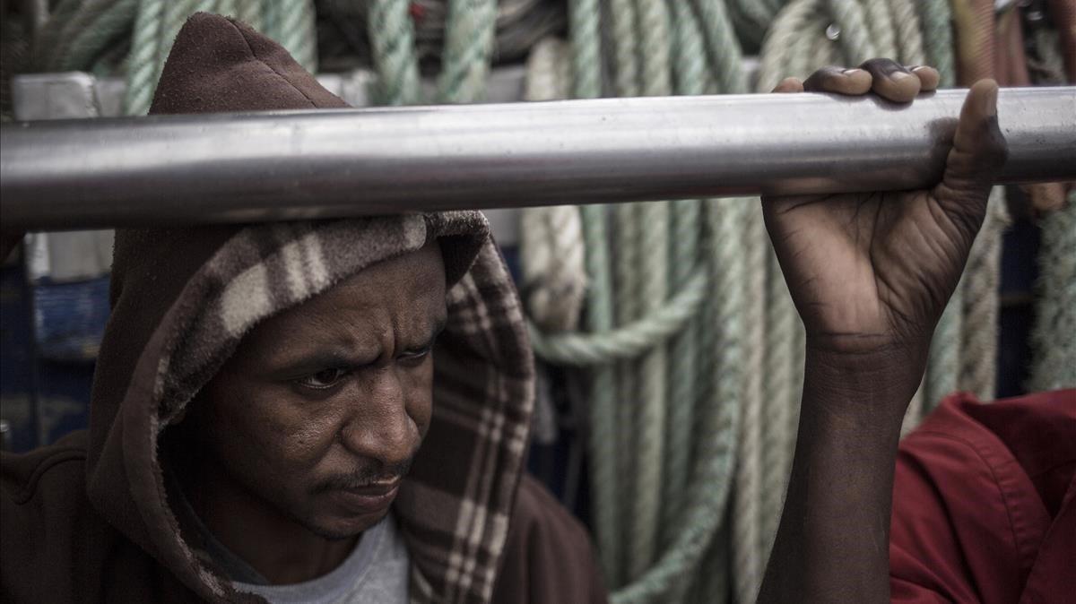 rjulve46098169 migrant sits aboard the spanish fishing vessel nuestra madre181201180504