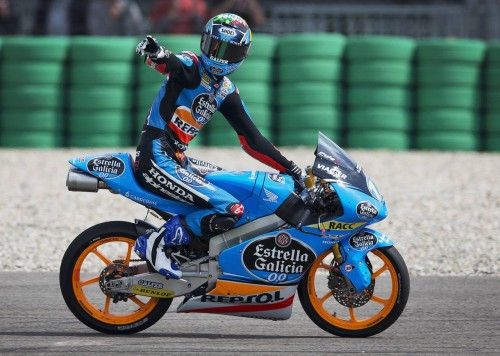 Honda Moto3 rider Alex Marquez of Spain celebrates on his bike after winning the Dutch Grand Prix in Assen