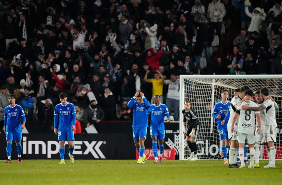 Real Madrid players react after Albacete scored its second goal during the Copa del Rey round of 16 soccer match between Albacete and Real Madrid, in Albacete, Spain, Wednesday, Jan. 14, 2026. (AP Photo/Jose Breton)