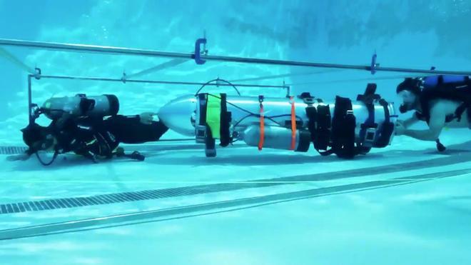 A device by Elon Musk’s SpaceX and The Boring Company, designed to help rescue the remaining members of a soccer team trapped in a flooded cave in Chiang Rai, Thailand, is being tested in a swimming pool in Los Angeles, California, U.S., in this still image taken from an undated video obtained from social media. MANDATORY CREDIT.  Twitter @elonmusk/via REUTERS THIS IMAGE HAS BEEN SUPPLIED BY A THIRD PARTY. NO RESALES. NO ARCHIVES MANDATORY CREDIT.     TPX IMAGES OF THE DAY
