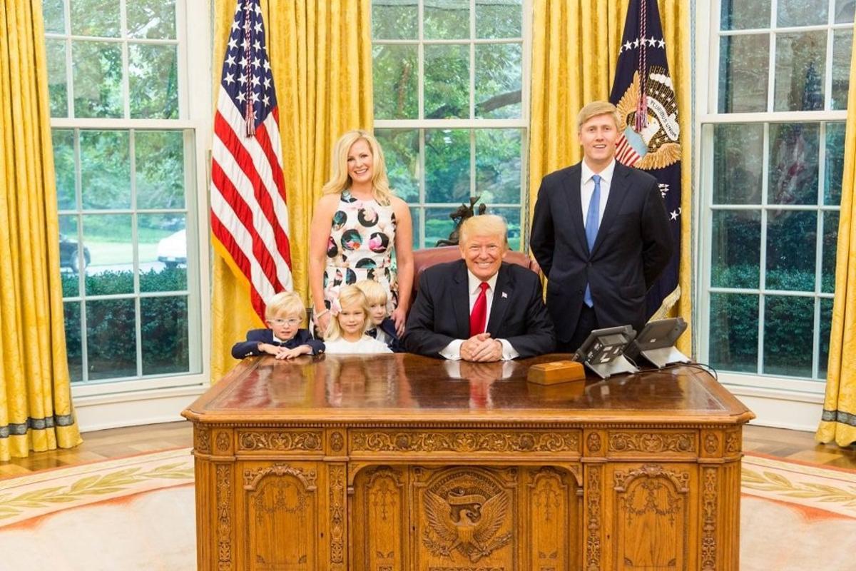 U S  President Donald Trump and Vice President s Chief of Staff Nick Ayers  R  and his wife Jamie Floyd with their children pose for pictures in the Oval Office at the White House in this social media photo released by Vice President Mike Pence s office in Washington  DC  U S   on July 28  2017   Courtesy Vice President s office Handout via REUTERS   ATTENTION EDITORS - THIS IMAGE HAS BEEN SUPPLIED BY A THIRD PARTY
