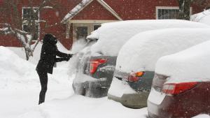 Wilder  United States   20 01 2019 - A woman brushes snow from her car in Wilder  Vermont  USA 20 January 2019  The region of central Vermont has received over 16 inches of snow so far  Temperatures were predicted to drop well below freezing overnight with officials warning of a  flash freeze  of all coated surfaces  Estados Unidos  EFE EPA HERB SWANSON