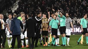 aguasch42481281 referees  r  and players stand in confusion on the pitch  du180312203940