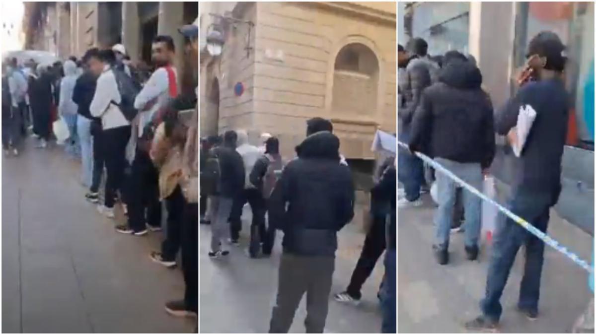 Cua d'immigrants a Barcelona per la regularització.