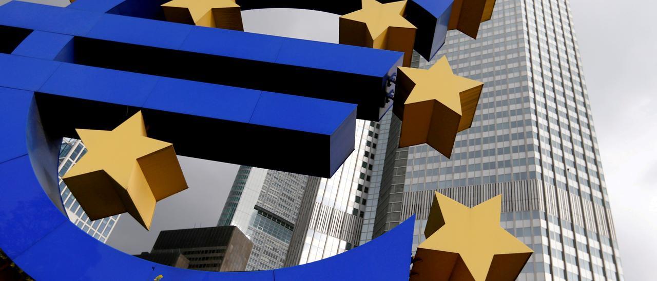 FILE PHOTO: A euro logo sculpture stands in front the headquarters of the European Central Bank  in Frankfurt, Germany