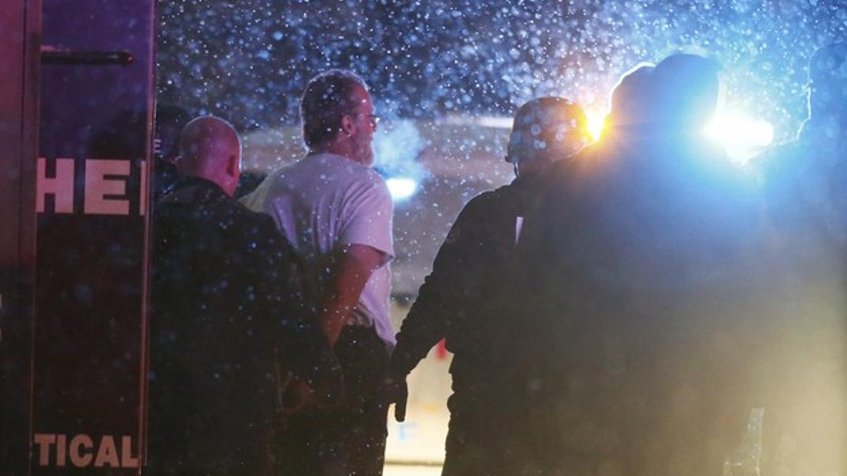 A suspect is taken into custody outside a Planned Parenthood center in Colorado Springs, Colorado