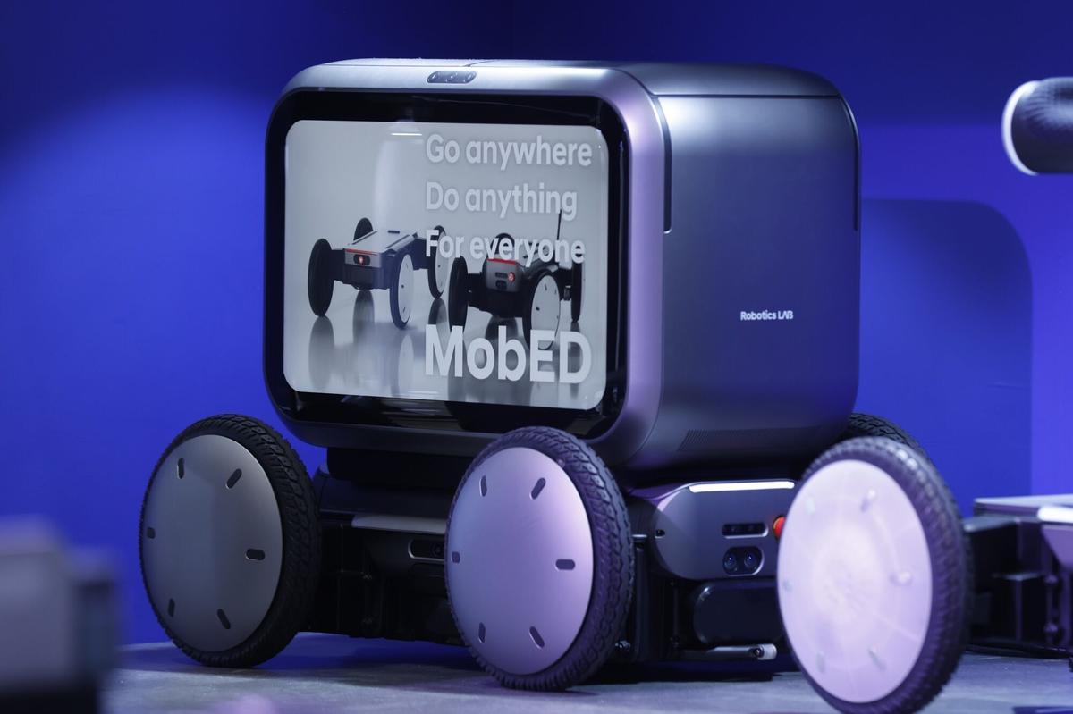 The Mobile Eccentric Droid (MobED) Delivery robot, developed by Hyundai Motor Group Robotics Lab, displayed at the International Robot Exhibition (iREX) in Tokyo, Japan, on Wednesday, Dec. 3, 2025. Hyundai Motor will start selling a four-wheeled robot powered by artificial intelligence next year as the South Korean carmaker ramps up its push into advanced mobility. Photographer: Kiyoshi Ota/Bloomberg