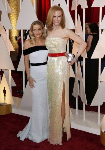 Reese Witherspoon poses with Nicole Kidman at the 87th Academy Awards in Hollywood