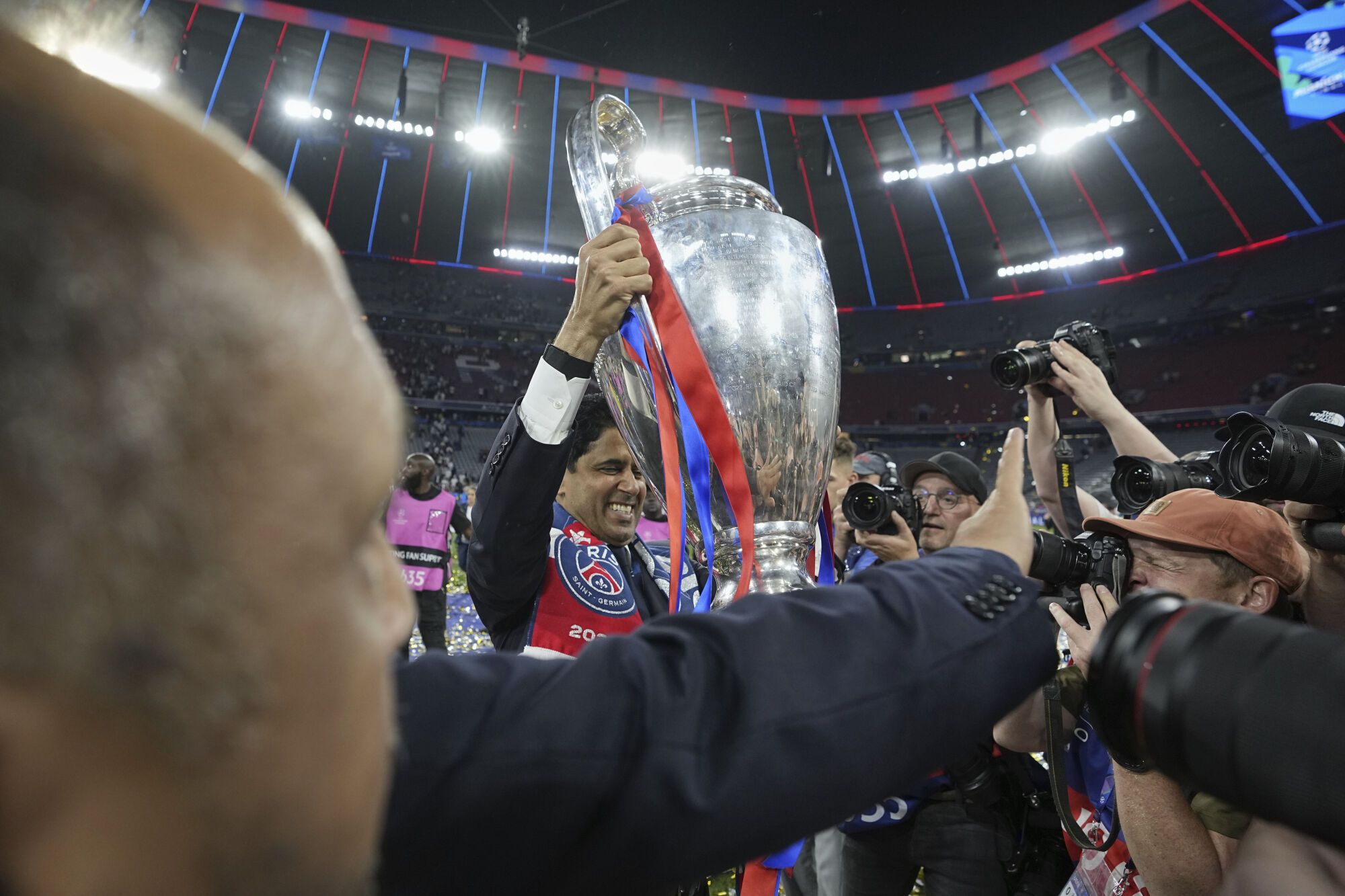 PSG president Nasser Al-Khelaifi holds the Champions League trophy after their win in the final soccer match against Inter Milan at the Allianz Arena in Munich, Germany, Saturday, May 31, 2025. (AP Photo/Martin Meissner)