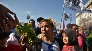 People receive free vegetables while protesting social conditions during the day of Saint Cajetan  the patron saint of Argentina and labour  in Buenos Aires  Argentina August 7  2019  REUTERS Pablo Stefanec NO RESALES  NO ARCHIVES