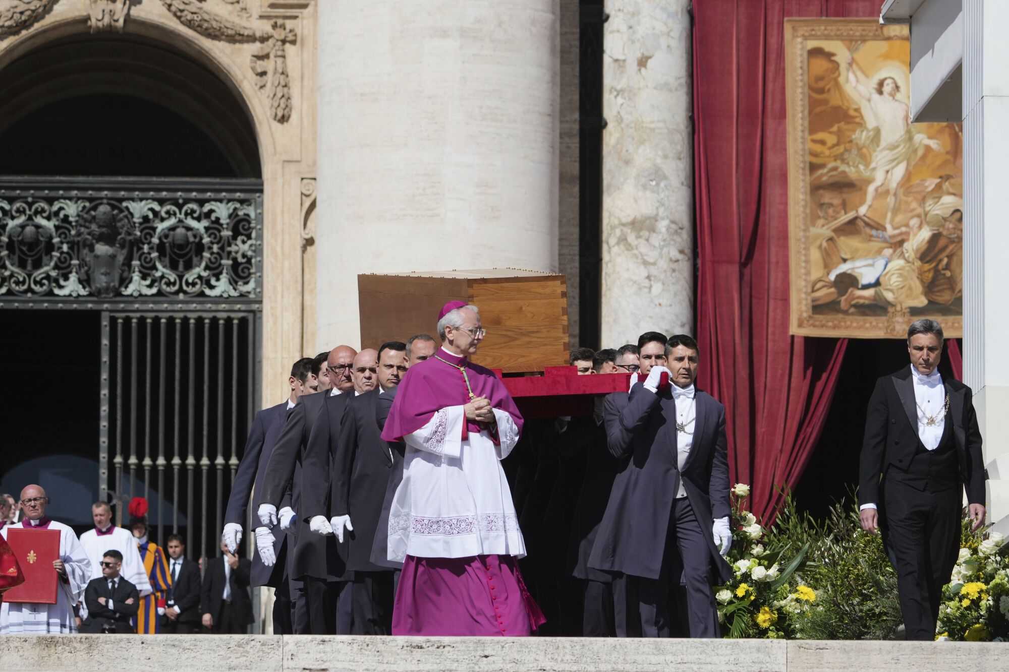 The coffin of Pope Francis is carried into St. Peter's Square during his funeral ceremony, at the Vatican, Saturday, April 26, 2025. (AP Photo/Alessandra Tarantino). EDITORIAL USE ONLY/ONLY ITALY AND SPAIN