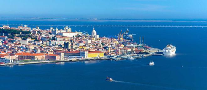 Aerial panorama of Lisbon old city center, view from Almada, Portugal