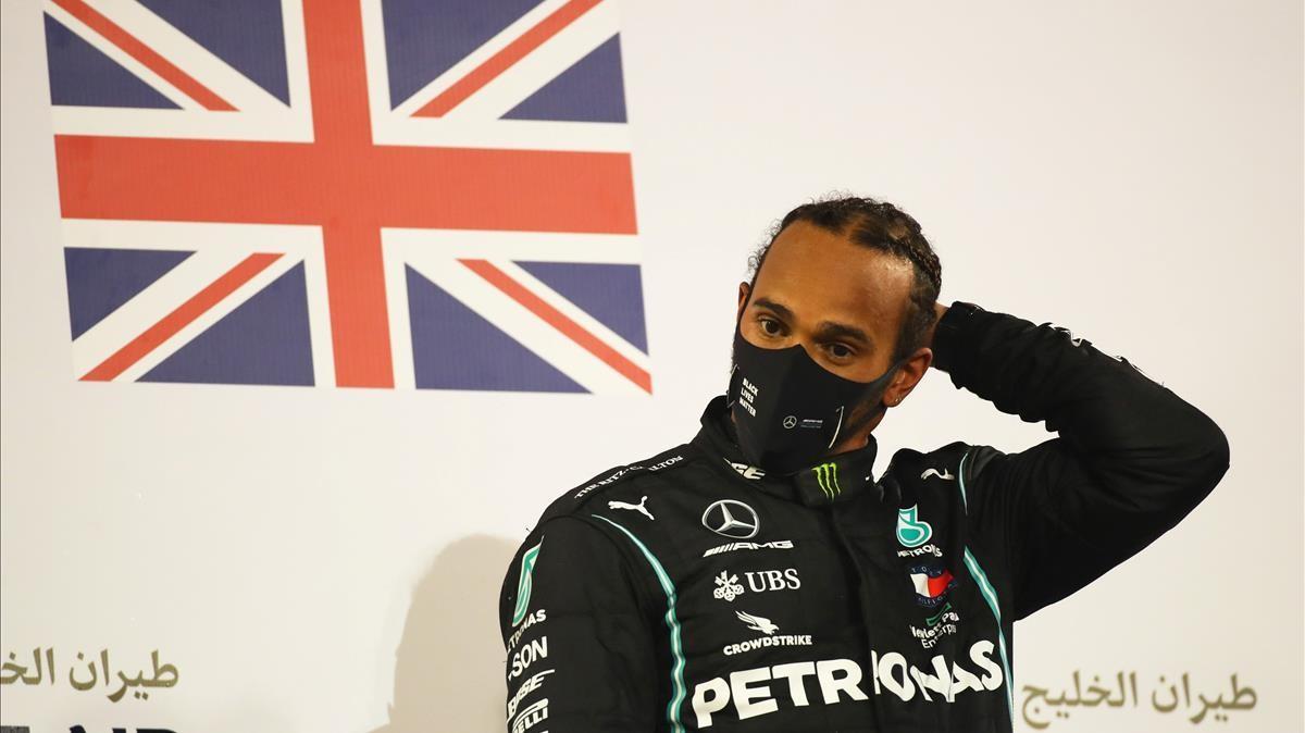 FILE PHOTO  Formula One F1 - Bahrain Grand Prix - Bahrain International Circuit  Sakhir  Bahrain - November 29  2020 Mercedes  Lewis Hamilton celebrates on the podium after winning the race Pool via REUTERS Bryn Lennon File Photo