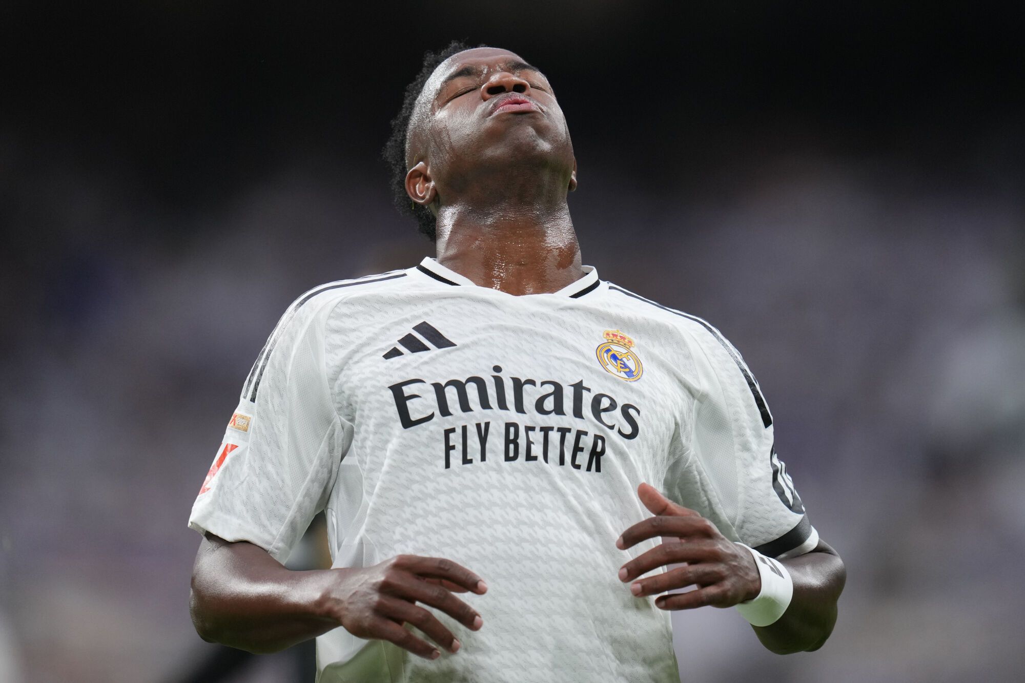 Real Madrid's Kylian Mbappe reacts after missing a chance to score a goal against Valencia during a Spanish La Liga soccer match between Real Madrid and Valencia at the Santiago Bernabeu stadium in Madrid, Spain, Saturday, April 5, 2025. (AP Photo/Manu Fernandez)