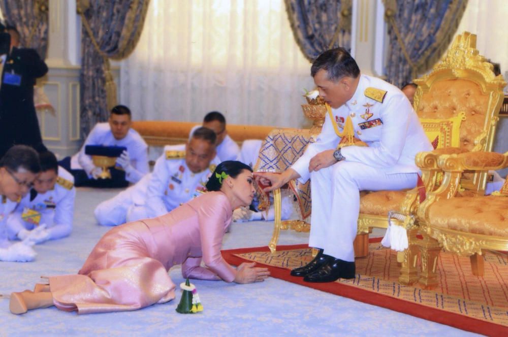 King Maha Vajiralongkorn and his consort, ...