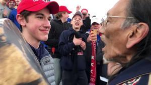 FILE PHOTO: Nicholas Sandmann, 16, a student from Covington Catholic High School stands in front of Native American activist Nathan Phillips in Washington, U.S., in this still image from a January 18, 2019 video by Kaya Taitano. Kaya Taitano/Social Media/via REUTERS/File Photo    ATTENTION EDITORS - THIS IMAGE HAS BEEN SUPPLIED BY A THIRD PARTY. MANDATORY CREDIT. NO RESALES. NO ARCHIVE. - RC1618EDA640